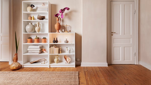A white BILLY bookcase and a LOHALS rug