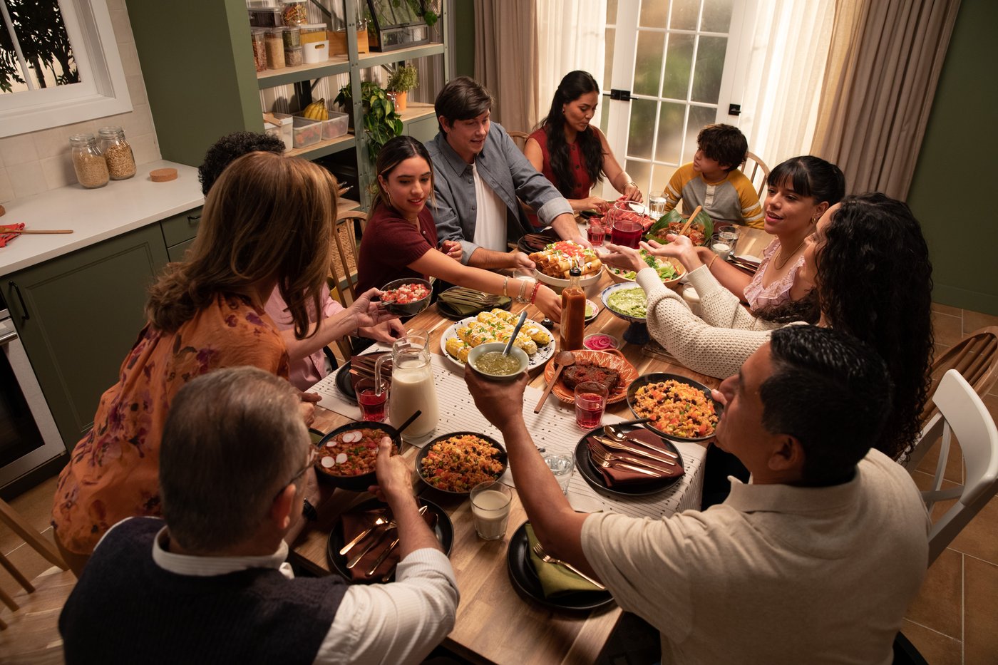 Family gathering around table