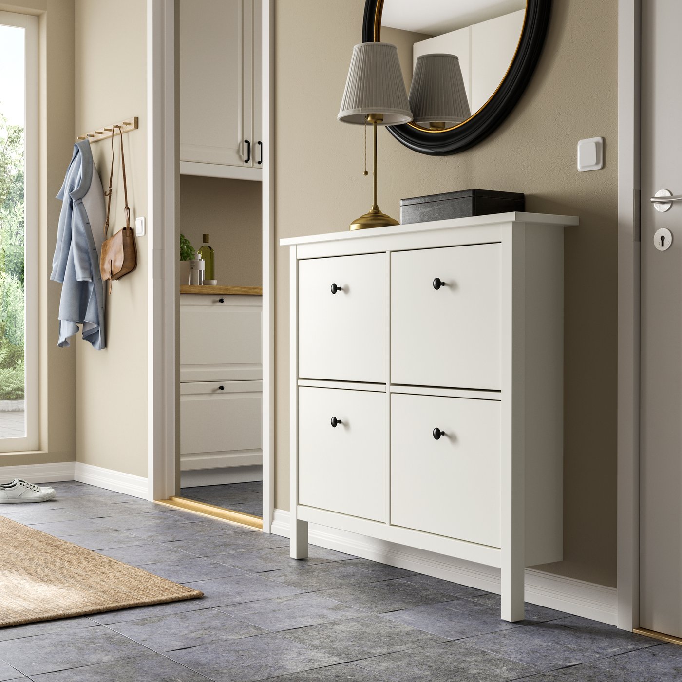 A white HEMNES shoe cabinet with 4 compartments