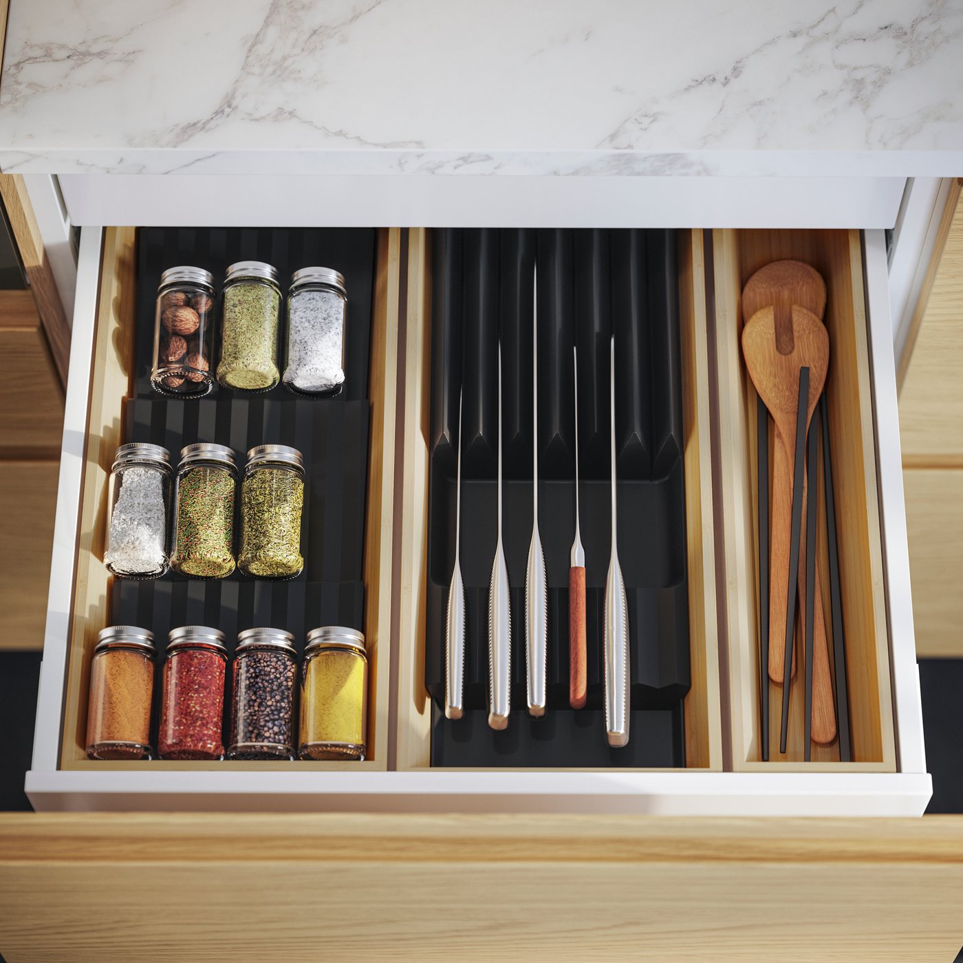A clear glass/stainless steel GULDFISK spice jar in the kitchen
