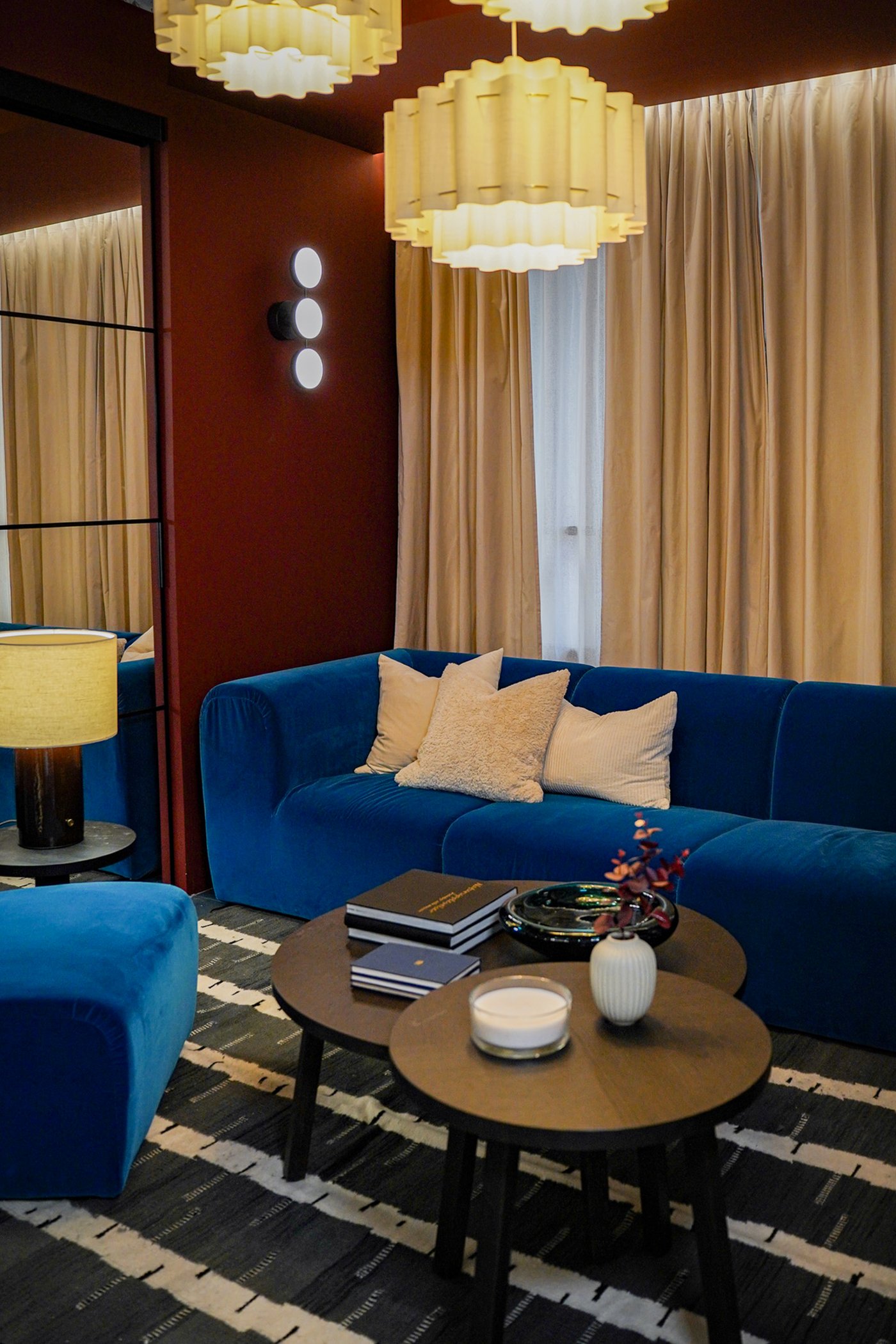 Curious Library room setting at IKEA Tampines, featuring a Alhamn dark turquoise STOCKHOLM 2025 3-seat sofa, STOCKHOLM 2025 Side table, and STOCKHOLM 2025 coffee table.