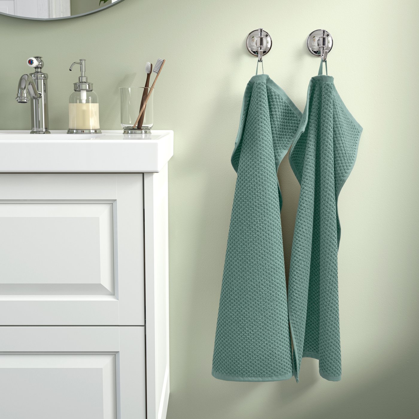 A turquoise GULVIAL hand towel