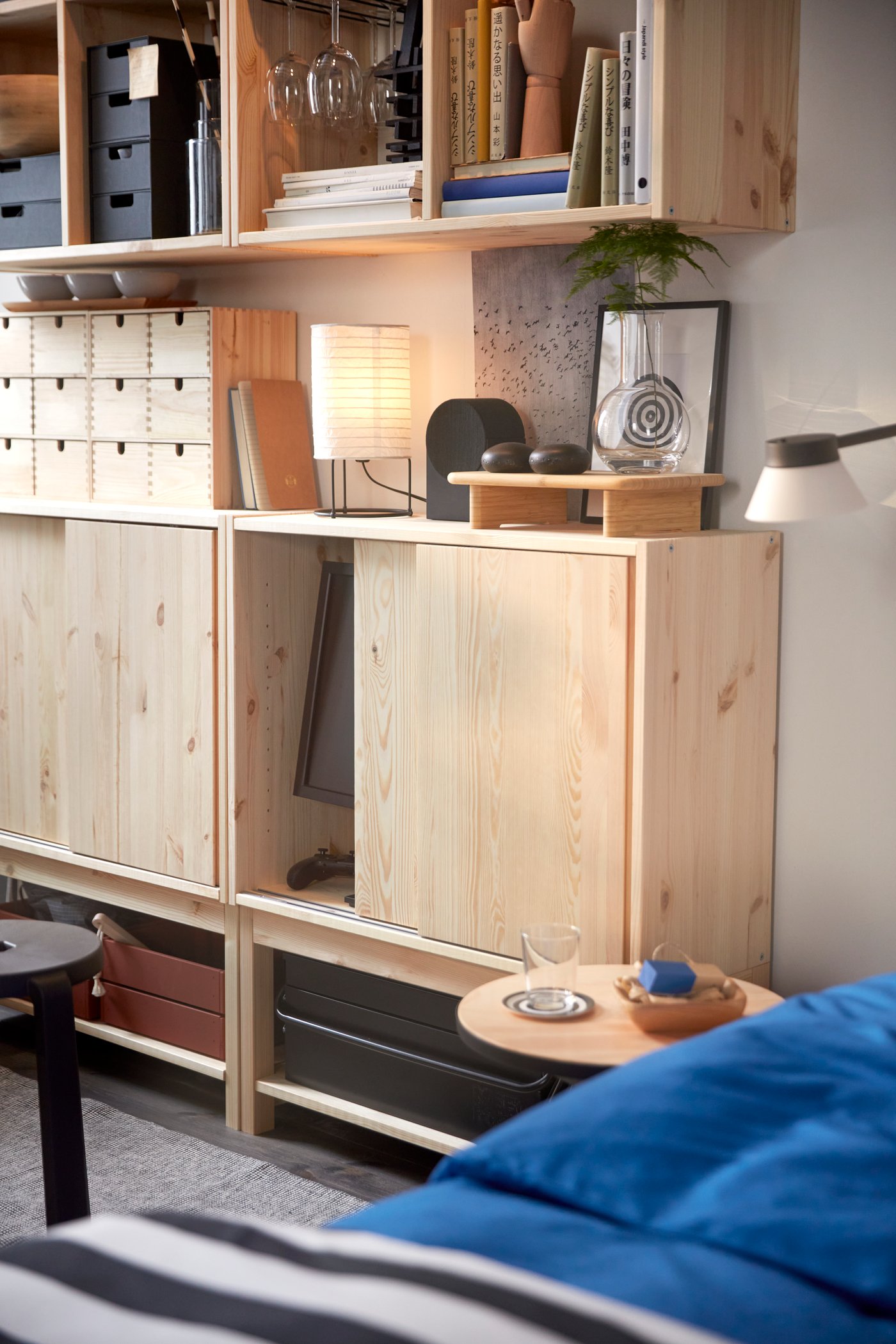 A pine IVAR shelv unit w sliding doors