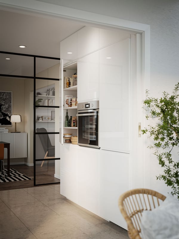 A Gunnared dark grey VEDBO high-back armchair in the kitchen