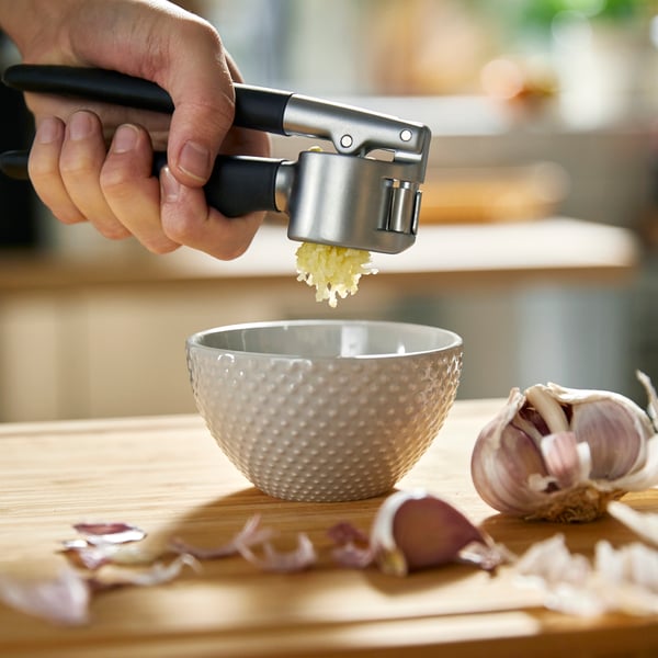 A black IKEA 365+ VÄRDEFULL garlic press in the kitchen