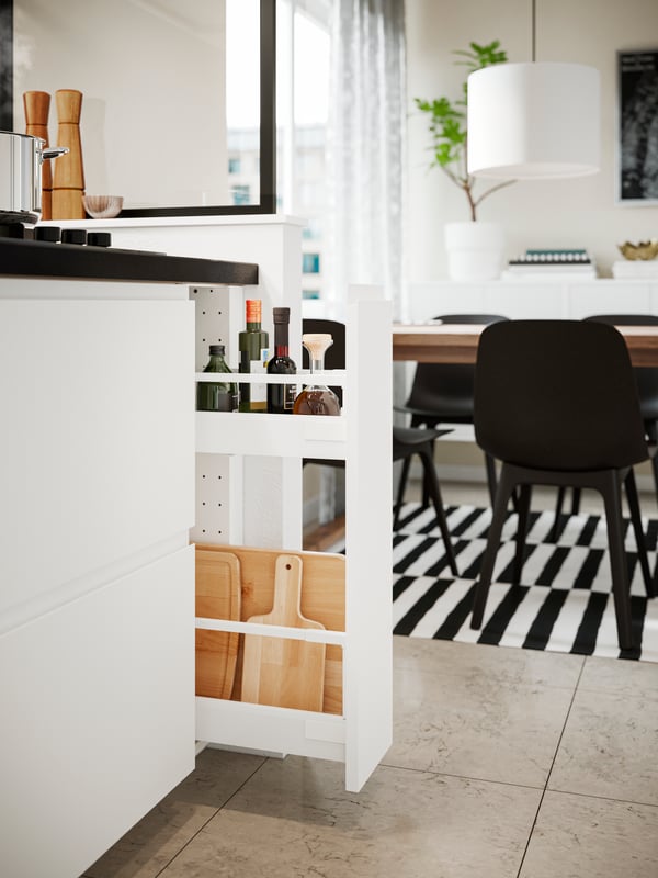 VOXTORP matt white smooth bottom cabinet with a pull out vertical drawer.