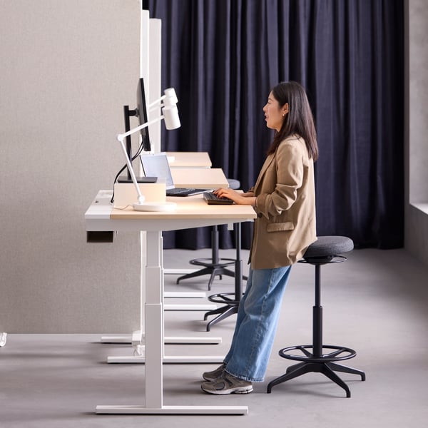 A dark grey/with heading tape SANELA curtains, 1 pair in the home office and MITTZON sit/stand desk