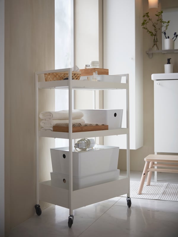 A white NISSAFORS trolley in the bathroom