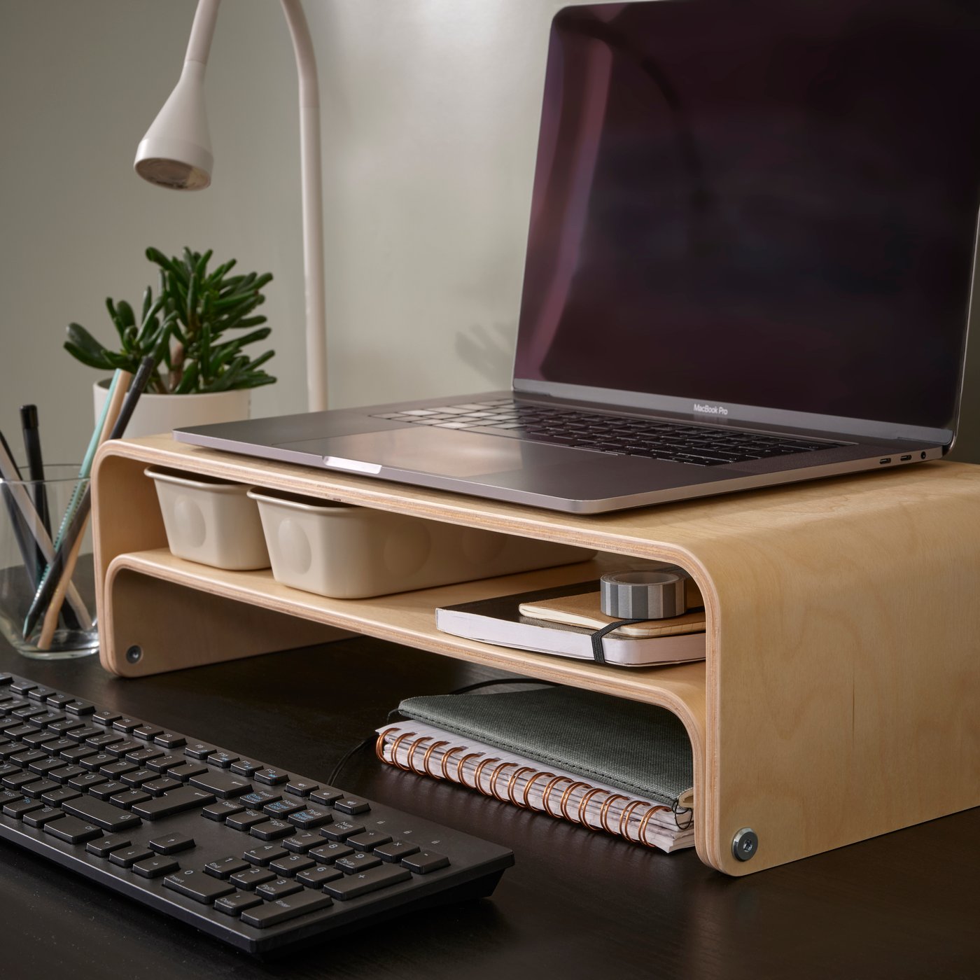 An IKEA VATTENKAR laptop/monitor stand in wood