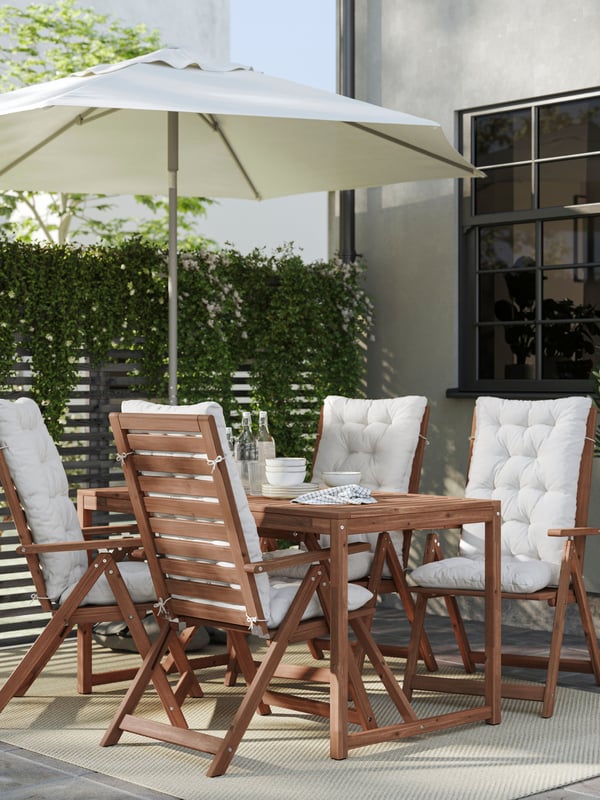 A light brown stained NÄMMARÖ table, outdoor
