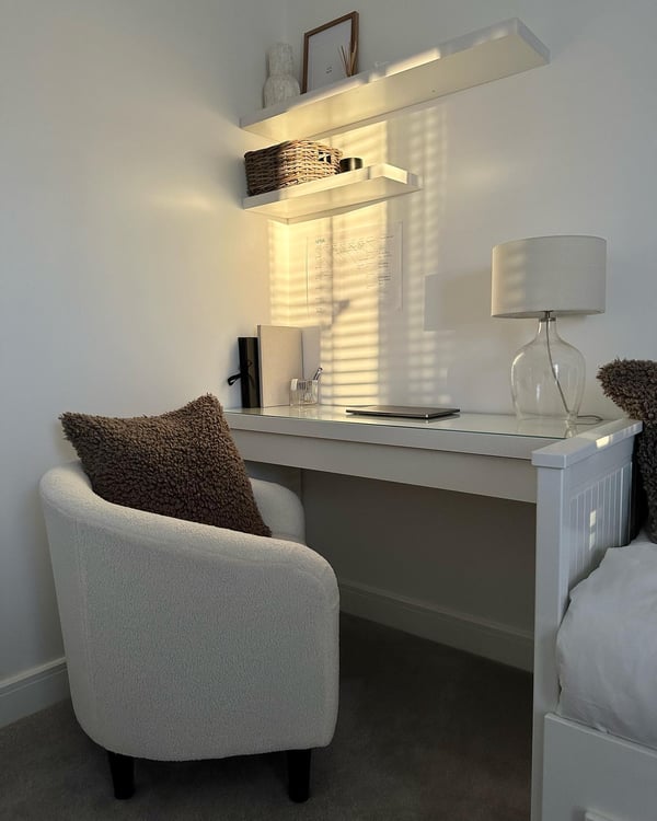 A grey storage basket in a home office