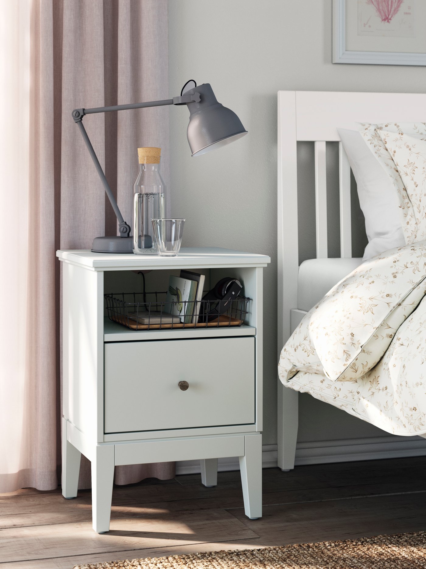 A white IDANÄS bed frame in the bedroom