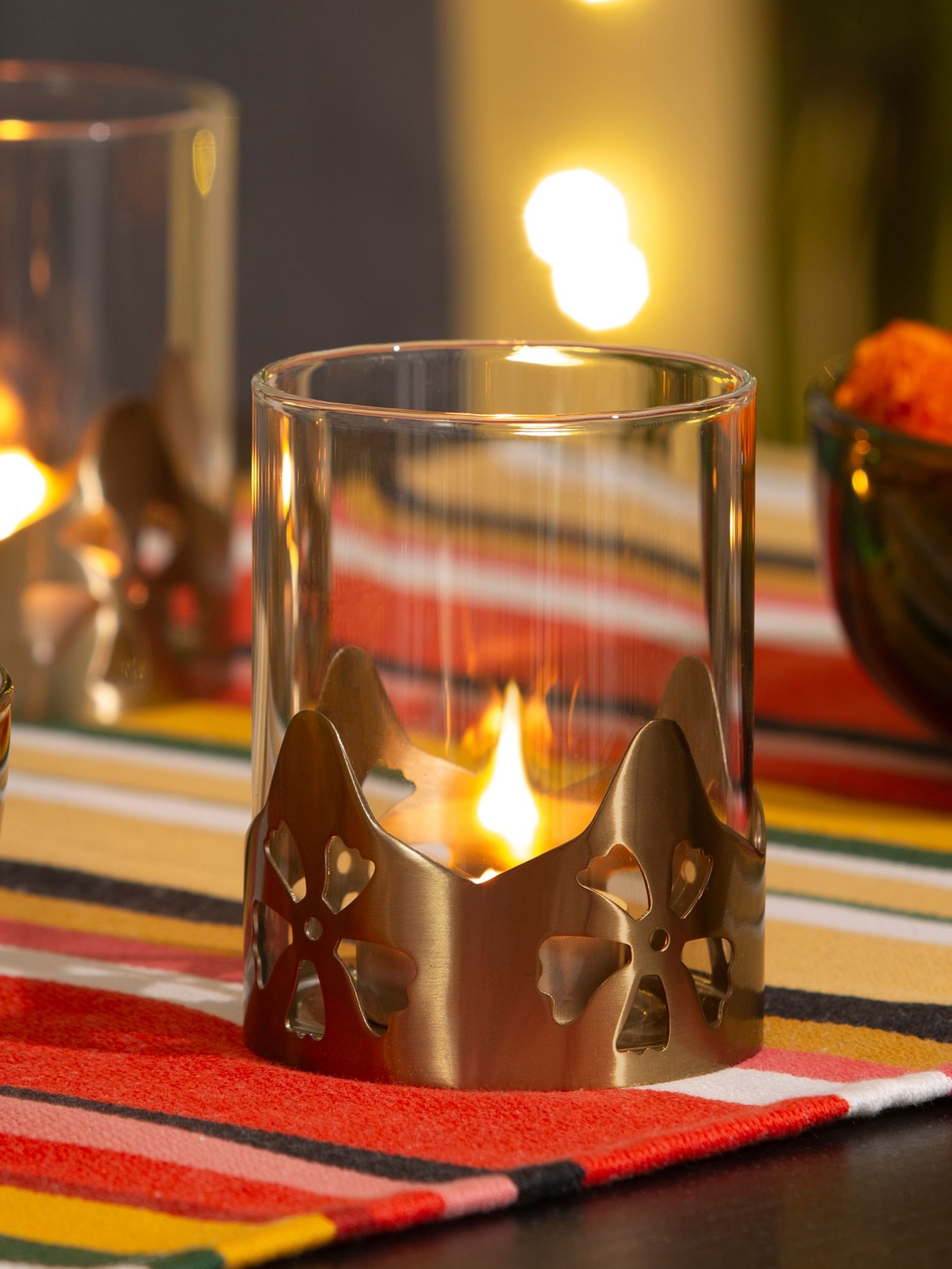 A glass/gold-colour AROMATISK tealight holder