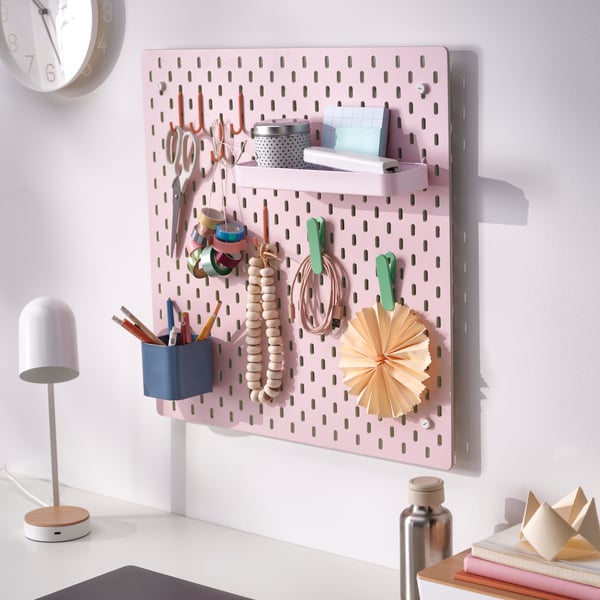 Pink SKÅDIS pegboard with colourful organisation accessories.