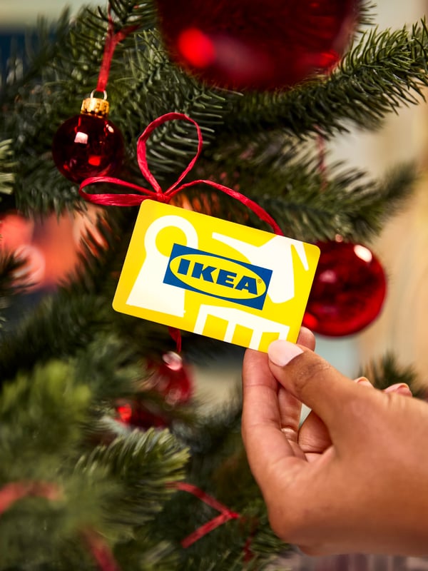 An IKEA gift card by the Christmas tree