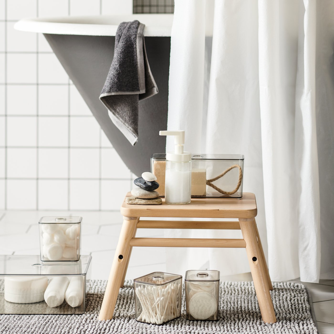 A dark grey/mélange HIMLEÅN washcloth in the bathroom