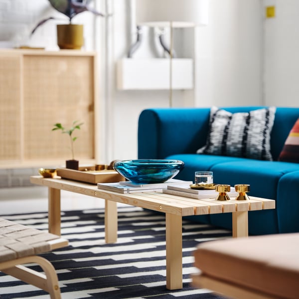 A dark blue-turquoise STOCKHOLM 2025 bowl in the living room