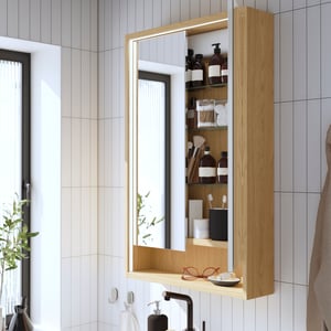 An oak effect FAXÄLVEN mirror cabinet w built-in lighting