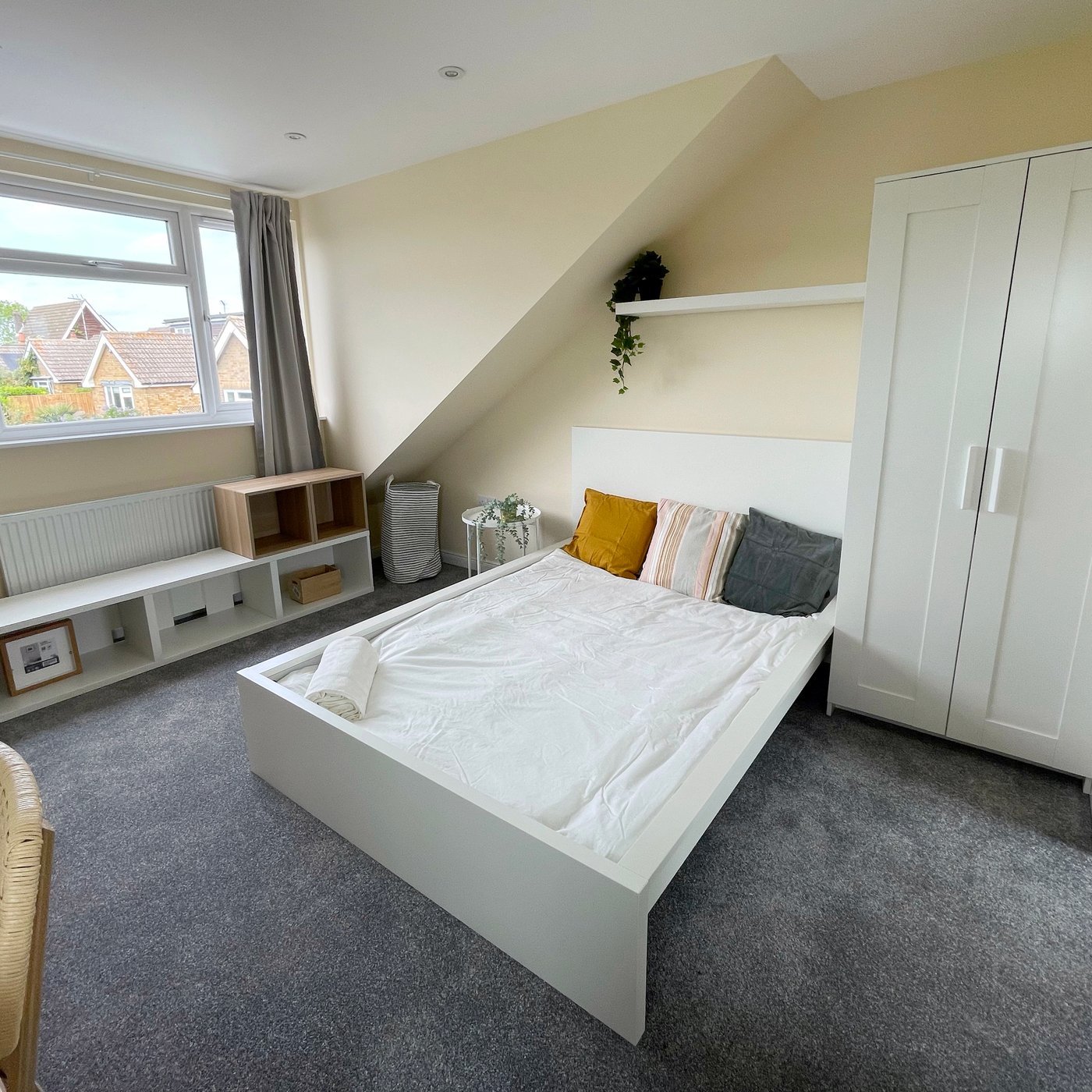 A bedroom furnished with IKEA furniture.