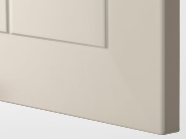 Detaljebildet av hjørnet på en STENSUND dørfront i beige.