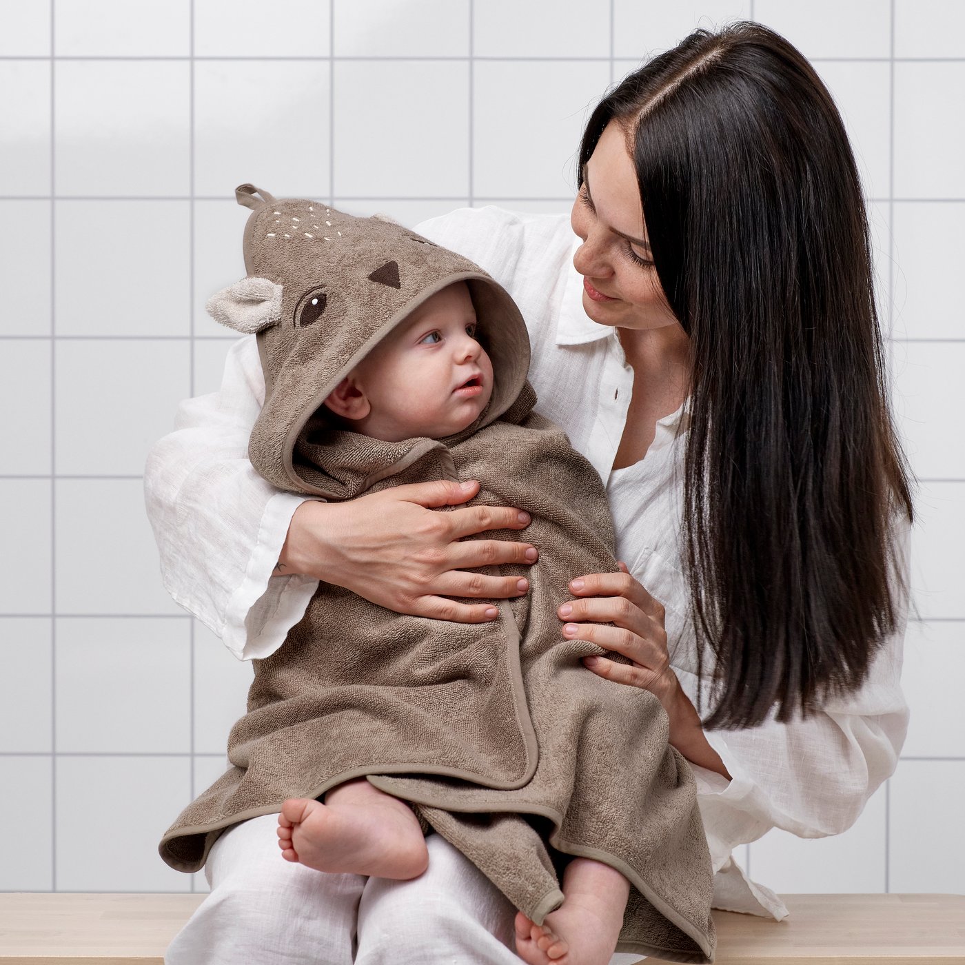A deer/brown TROLLDOM baby towel with hood