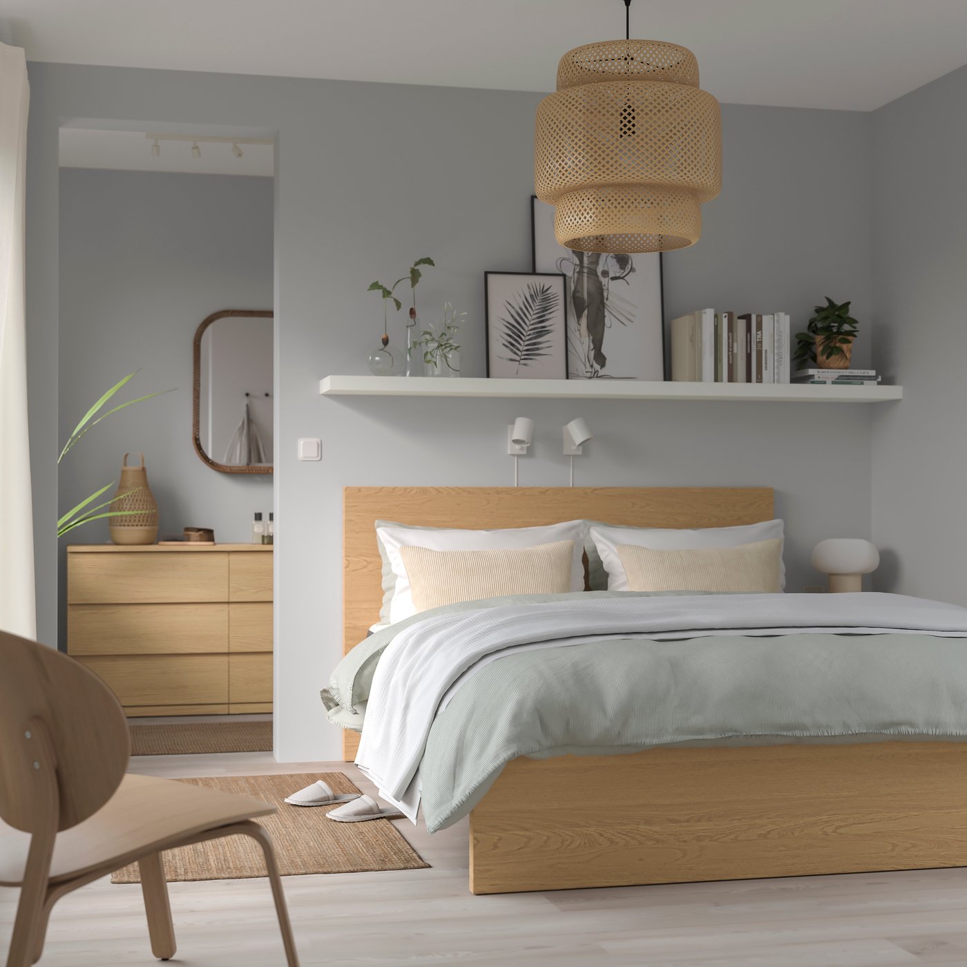 An oak veneer MALM bed frame, high in the bedroom