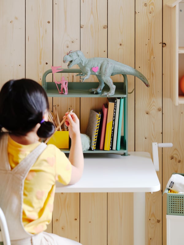 A white/grey-green ÖVNING trolley in the childrens room.