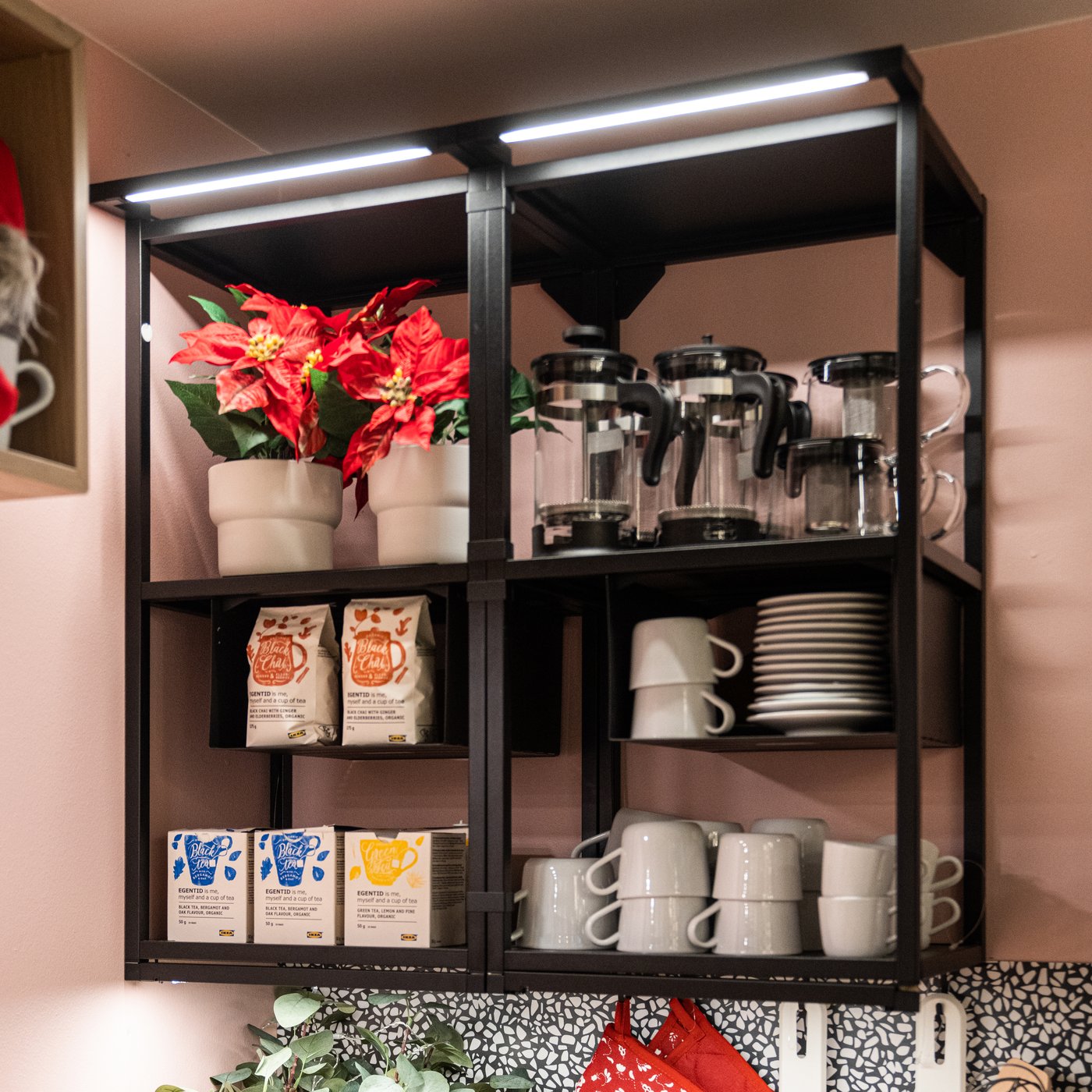 An anthracite ENHET wall frame with shelves in the kitchen