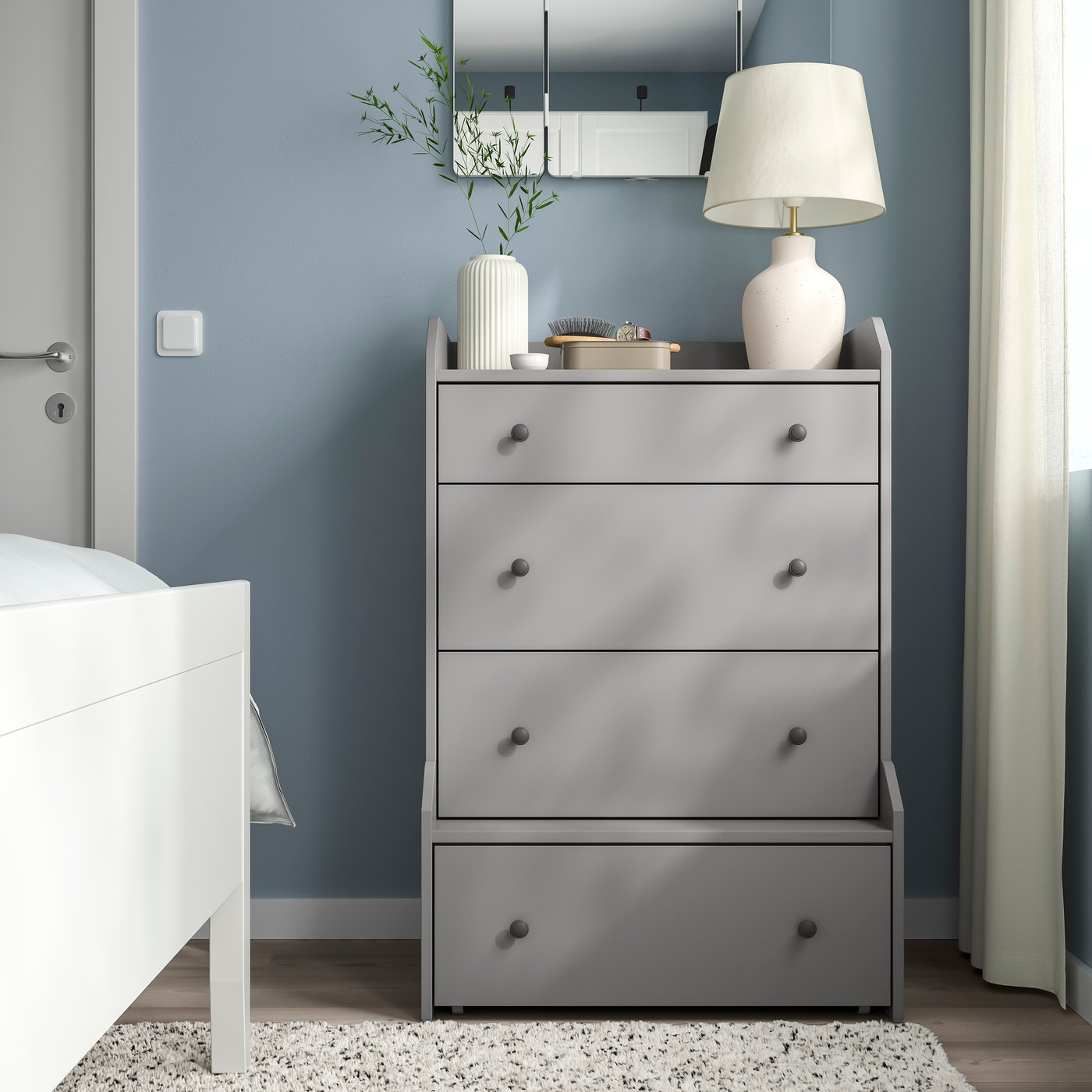 A grey HAUGA chest of 4 drawers