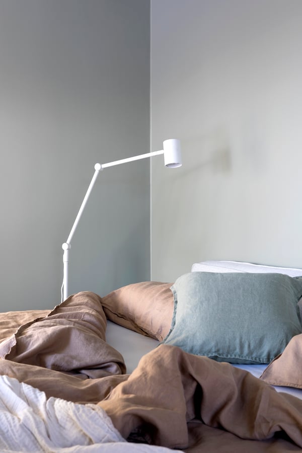 An off-white VALLKRASSING throw