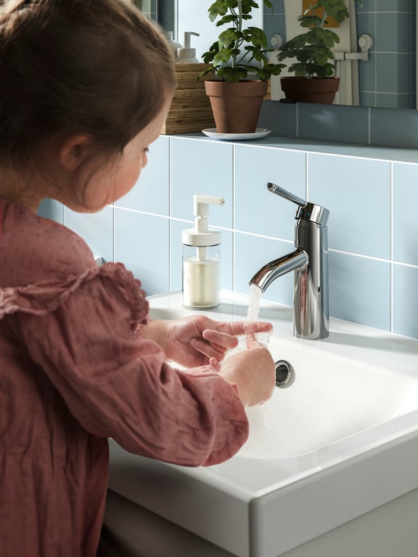 A chrome-plated DALSKÄR wash-basin mixer tap in the bathroom