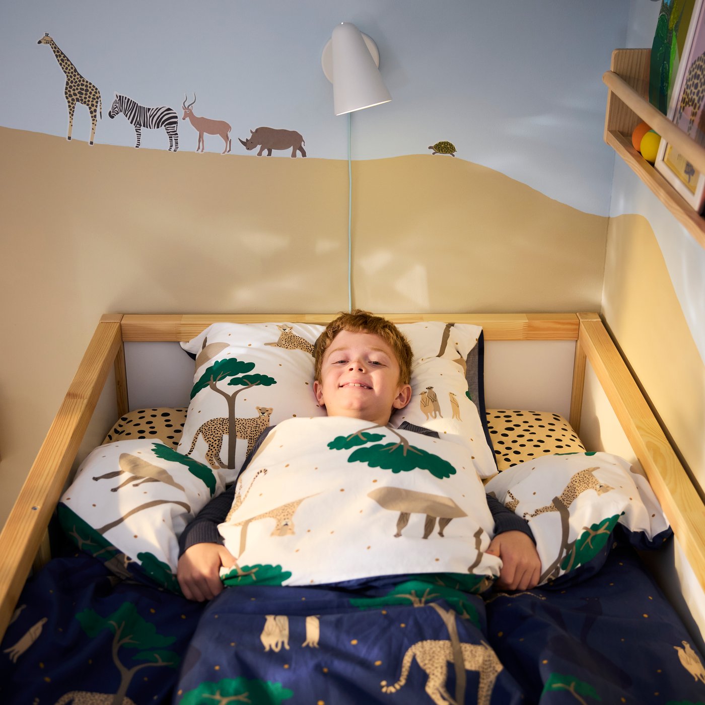 A light white stained pine FLISAT wall storage in the childrens room