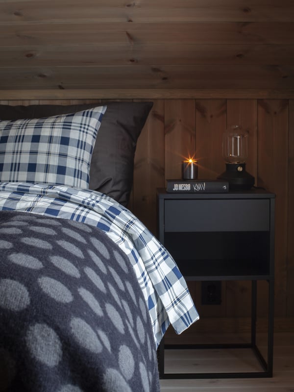 A black VIKHAMMER bedside table