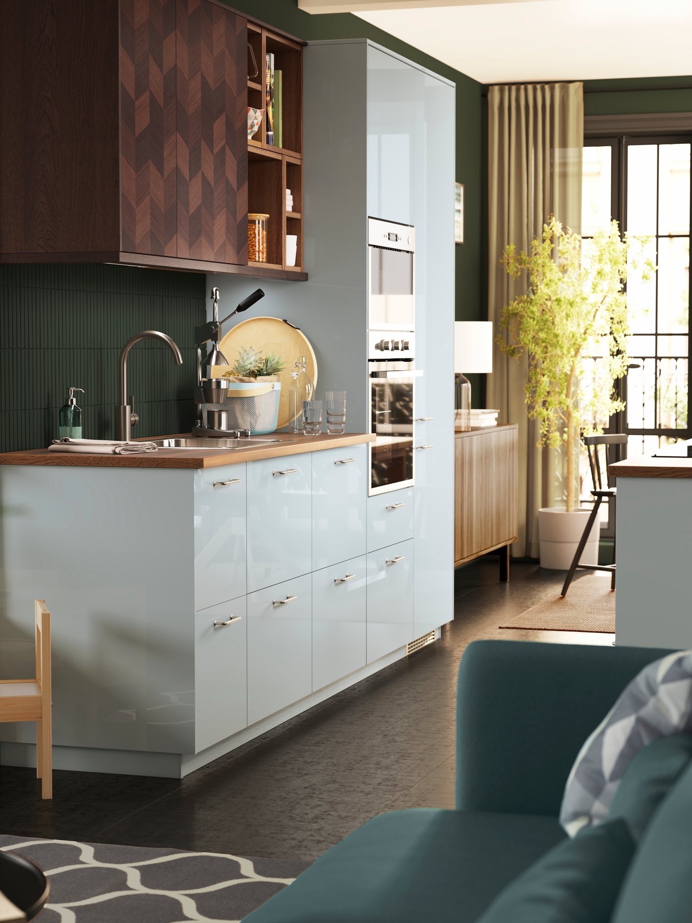 A kitchen with light grey-blue high-gloss KALLARP drawer fronts