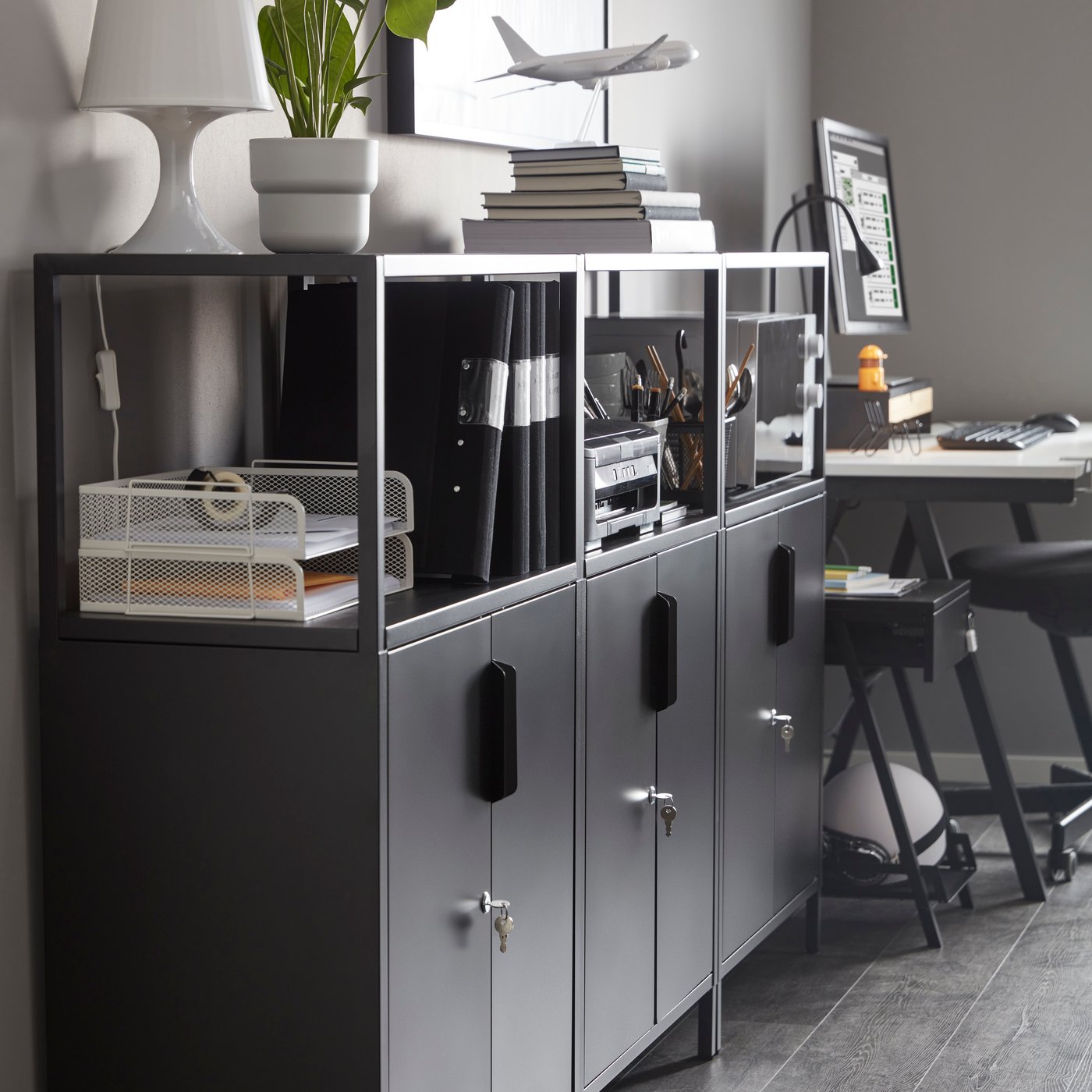An anthracite TROTTEN cabinet with doors