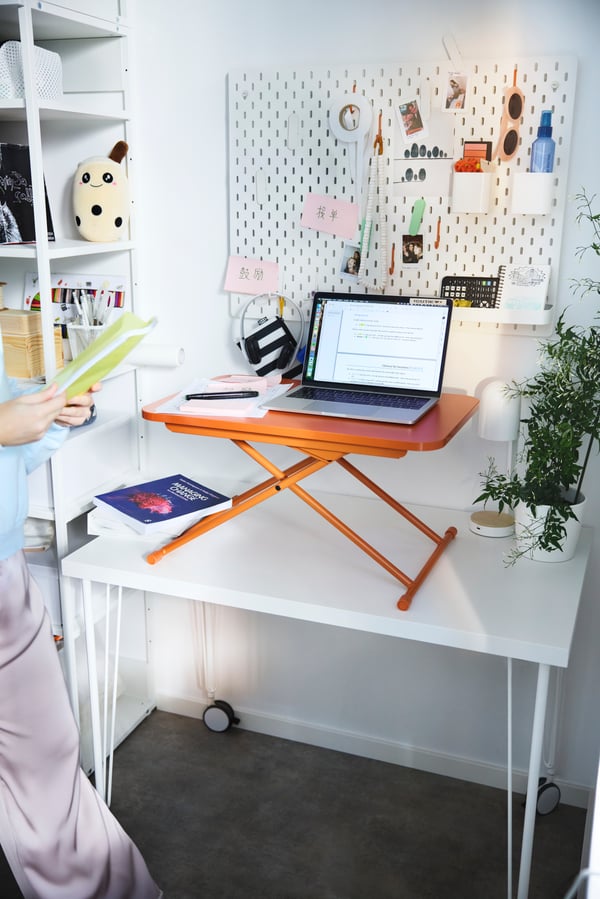 A white PLATSA open shelving unit in the home office