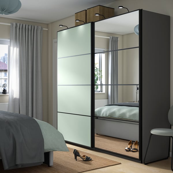 A dark grey double sided/light green mirror glass PAX wardrobe with sliding doors