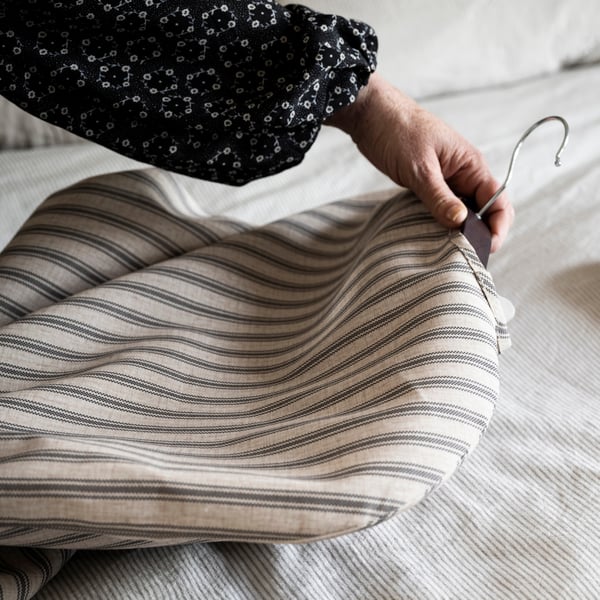 A textile striped/beige anthracite RÅGODLING clothes cover
