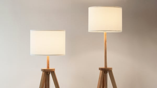 Two lamps side by side dimly lit.