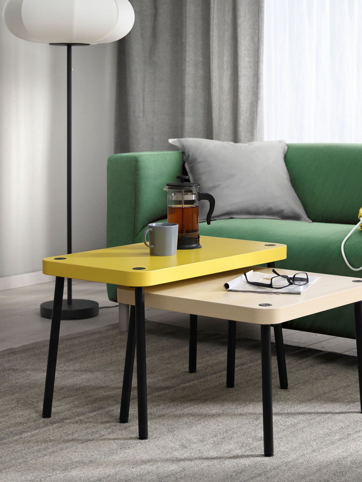 An yellow/birch effect SONHULT nest of tables