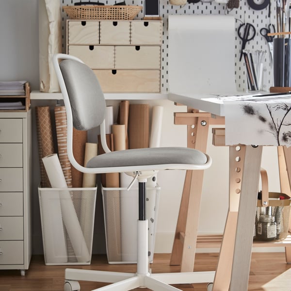A white and grey ÖRFJÄLL  desk chair in an office