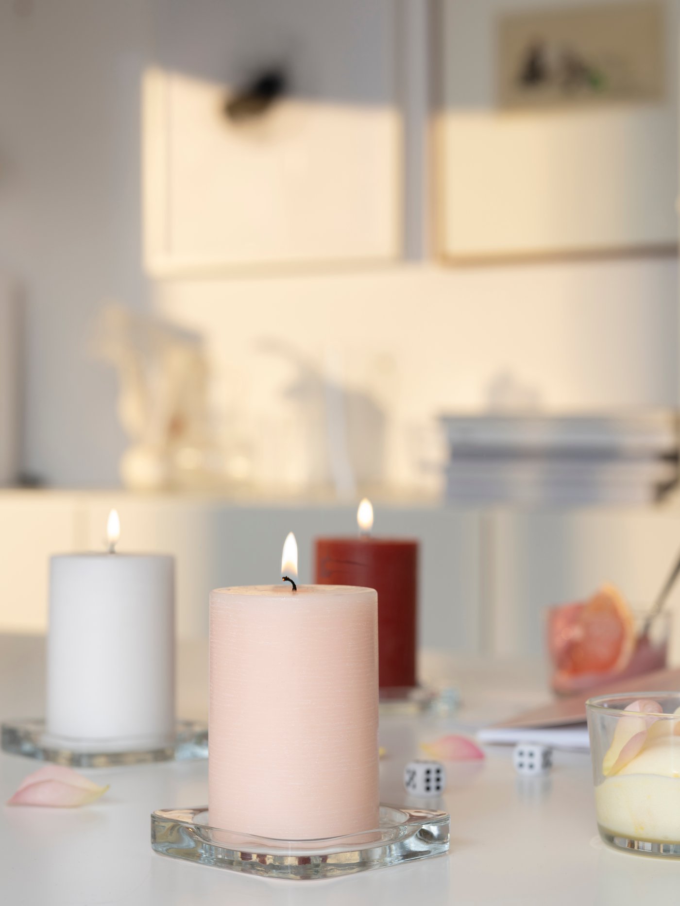 A grapefruit & rose/mixed colours ÄDELSYREN scented pillar candle