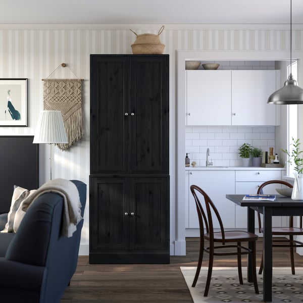 A black HAVSTA storage combination with doors in the living room