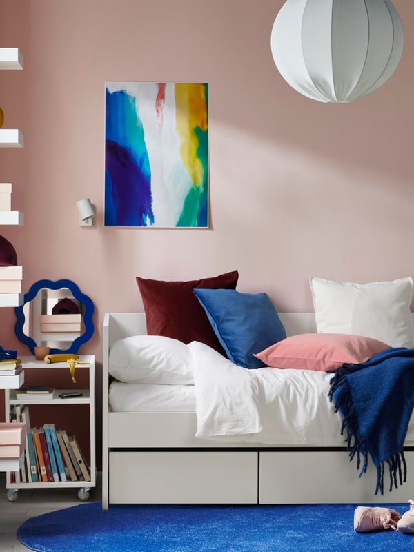 A white VIHALS day-bed frame with storage