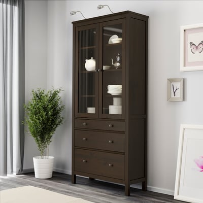 A black-brown HEMNES glass-door cabinet with 3 drawers