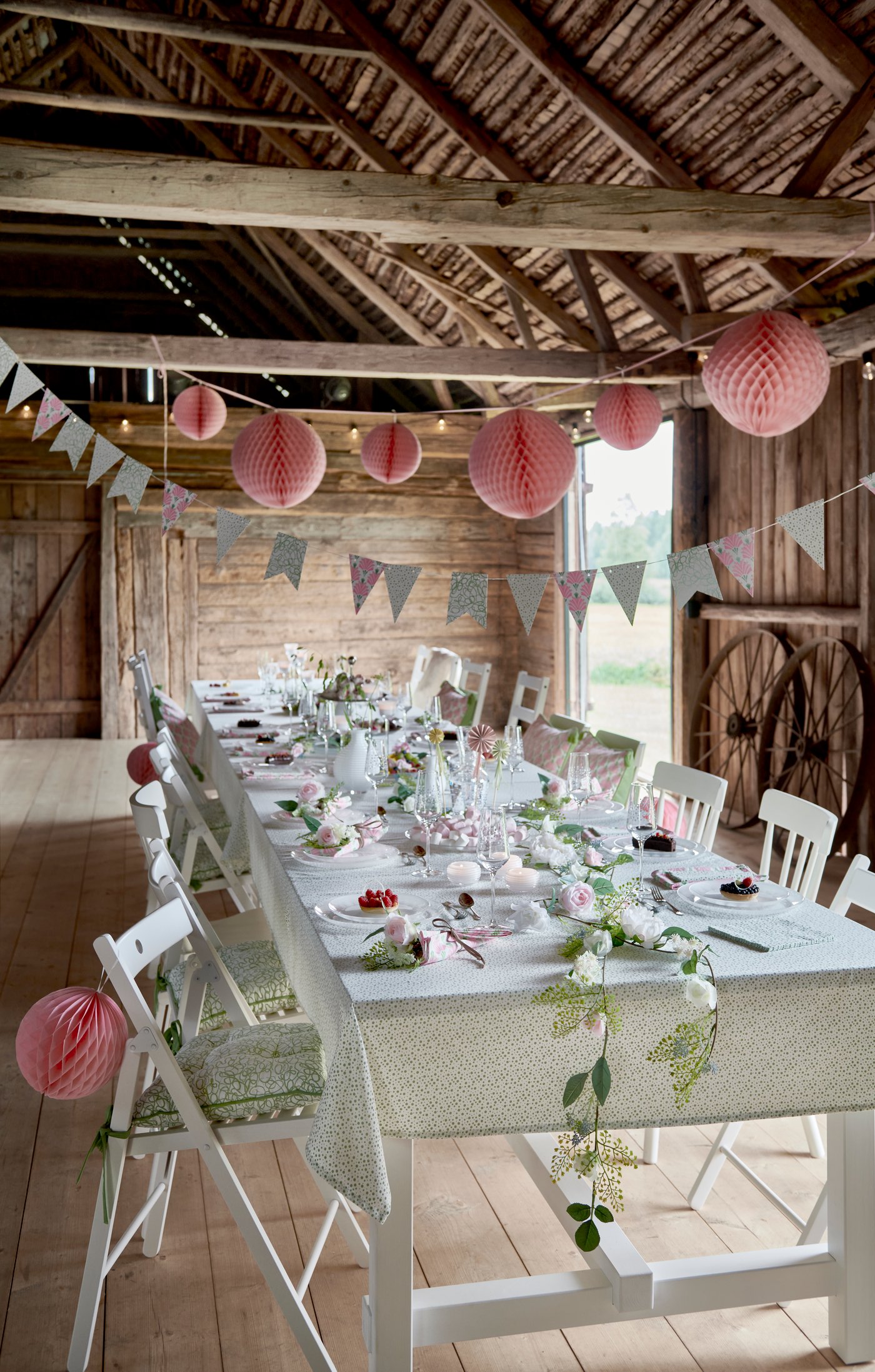 INBJUDEN flag bunting in assorted patterns/colours hangs in the dining room