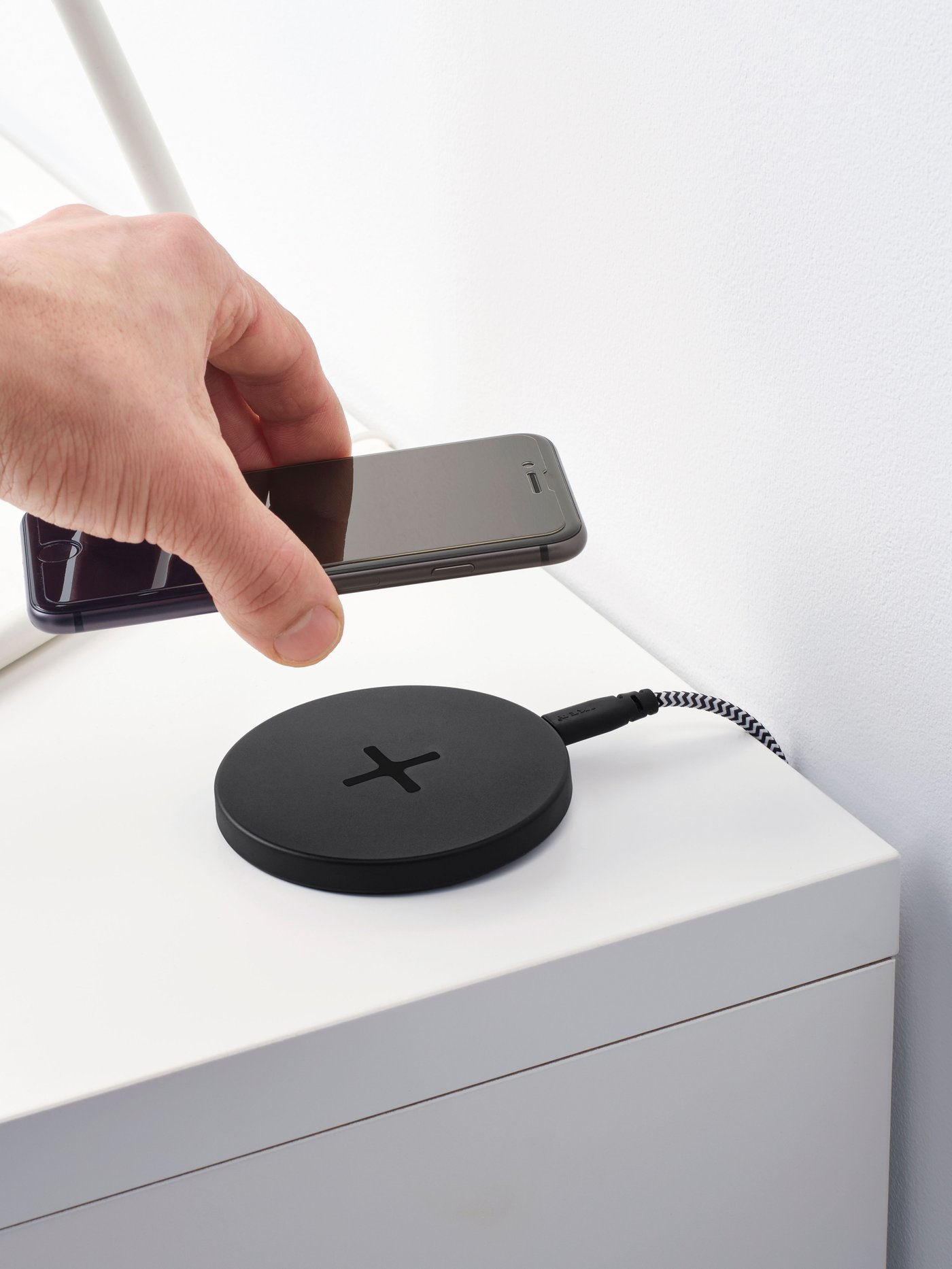 A black LIVBOJ wireless charger