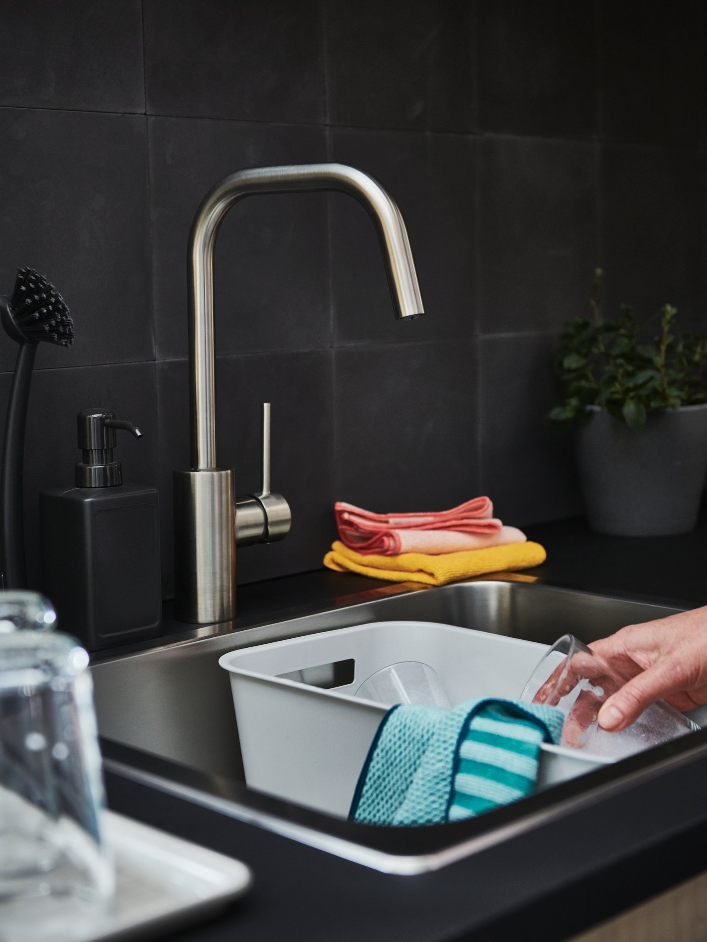 A grey RINNIG soap dispenser