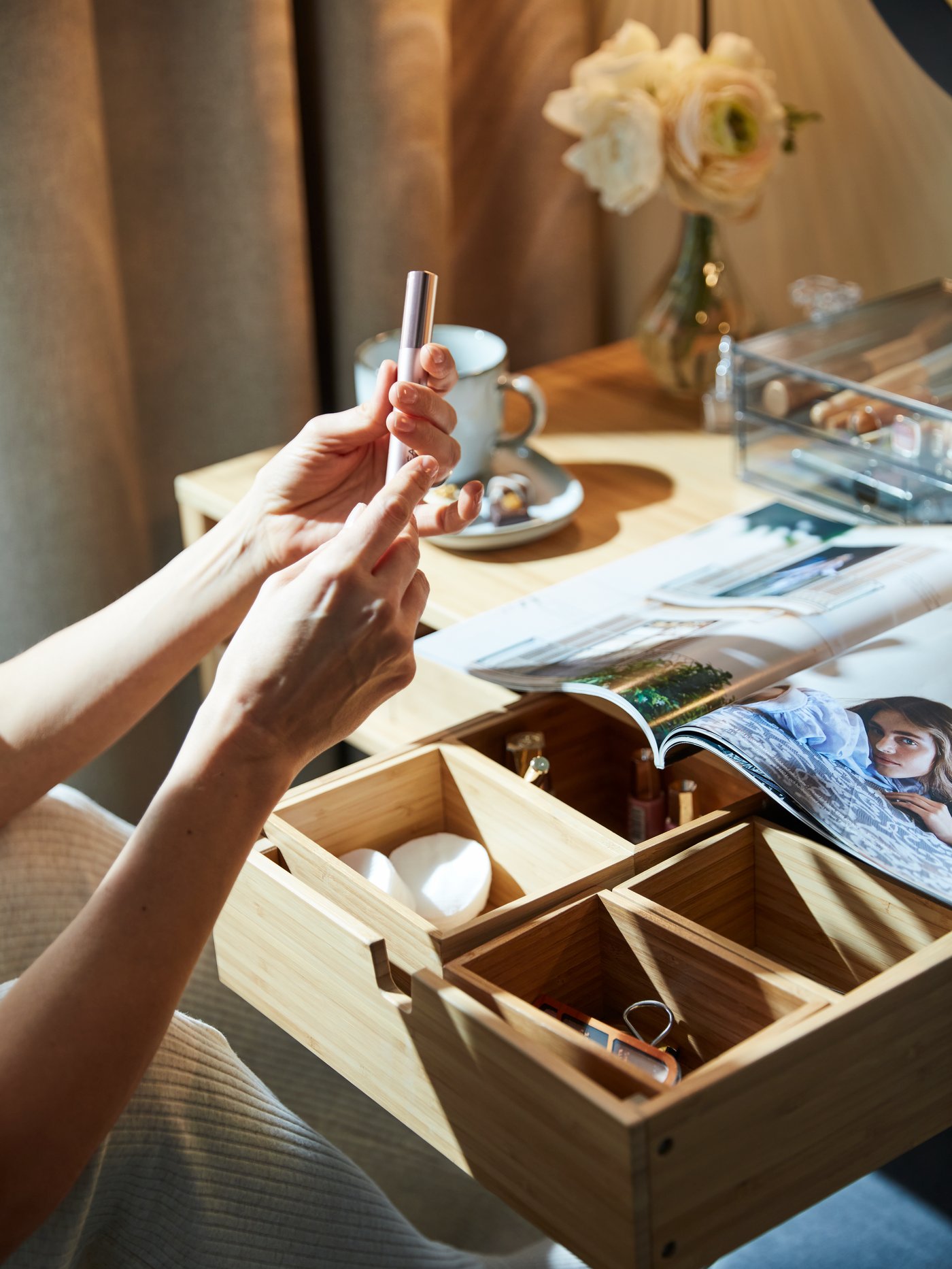 A smoked GODMORGON mini chest with 2 drawers in the bedroom