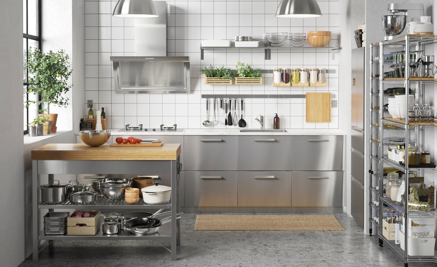 A RIMFORSA work bench made of stainless steel/bamboo in<span intento_protect_9=0> </span>the<span intento_protect_10=0> </span>kitchen